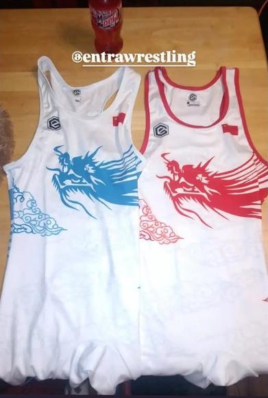 Blue and red dragon singlets laid out together