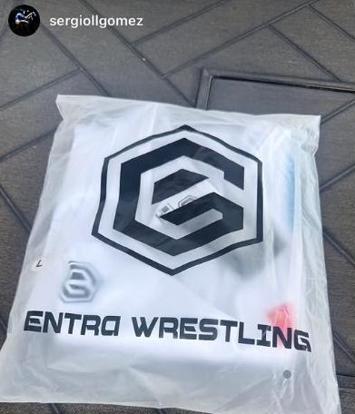 Sealed white Entra-branded package on pavement